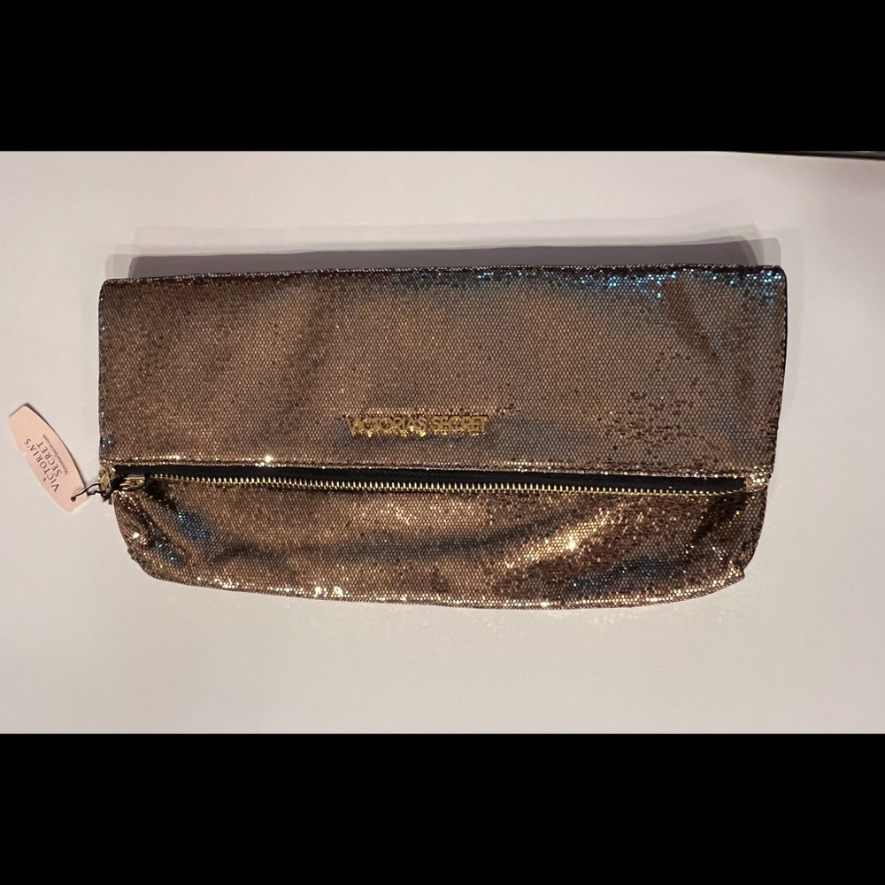 Gold tone night out clutches. Brand new with tag and with mirror inside.